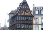 P1000890  Maison Kammerzell, Built in 1427 but twice transformed in 1467 and 1589, the building as it is now historically belongs to the German Renaissance but is stylistically still attached to the Rhineland black and white timber-framed style of civil (as opposed to administrative, clerical or noble) architecture.